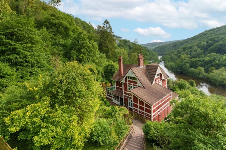 The Norwegian former fishing lodge situated in its wooded and discrete setting, with stunning views overlooking the Wye Gorge to the south and north.