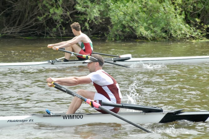 Two scullers race for line