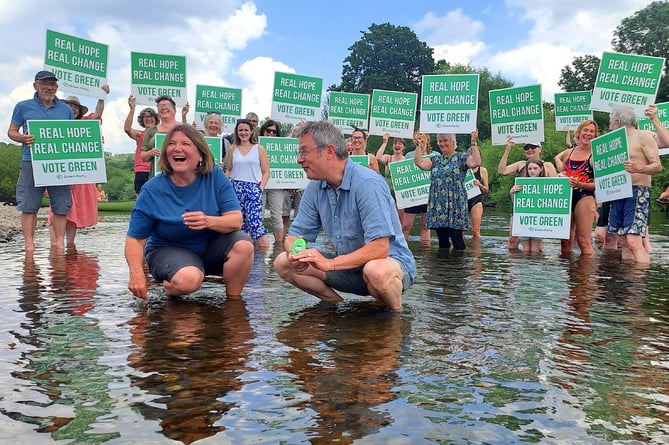 River Cottage star Hugh Fearnley-Whittingstall and North Herefordshire Green candidate Ellie Chowns in the Wye at Hoarwithy