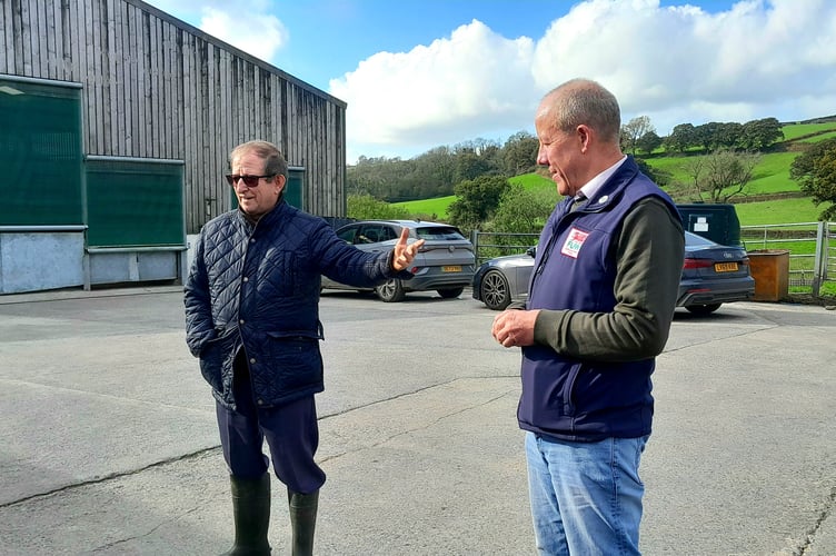 Brian Walters (left) sharing his farm history with FUW President Ian Rickman.