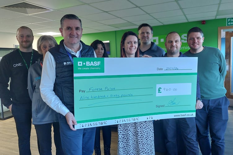 BASF staff Adam Wilce, Sally Thomas-Brown, site manager Chris Turner presenting cheque to Amy, Miranda Palmer, James Miles, Mike Jones and Ben Browning